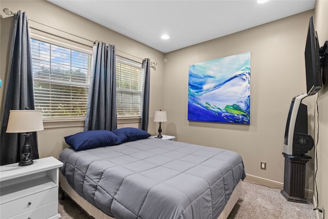 bedroom featuring recessed lighting, light colored carpet, and baseboards