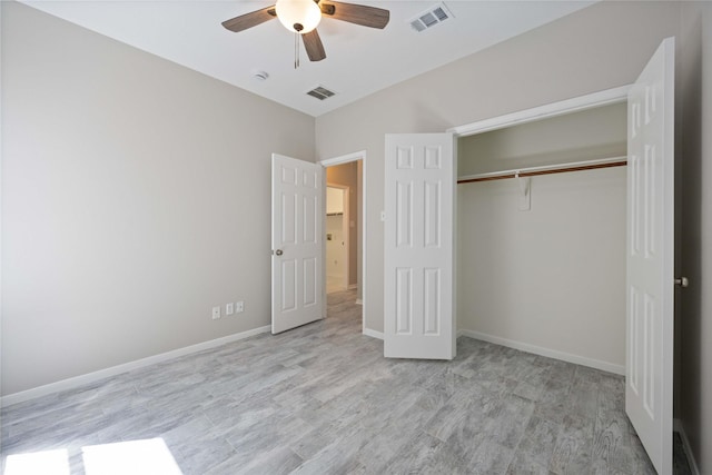 unfurnished bedroom with a closet, visible vents, and baseboards