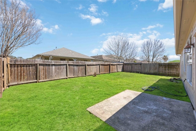 view of yard featuring a patio and a fenced backyard