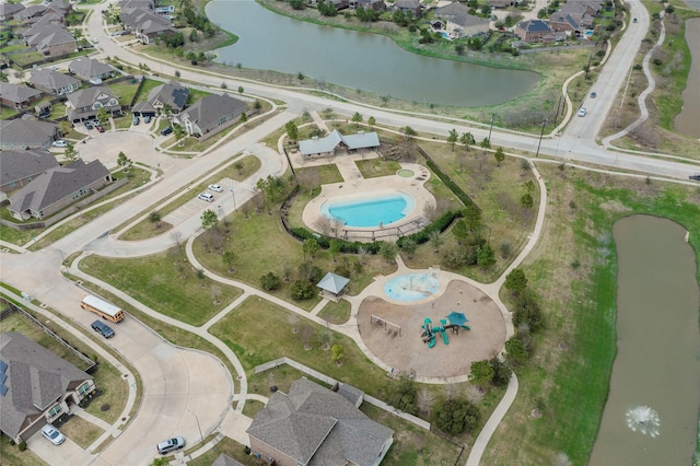 bird's eye view featuring a water view and a residential view