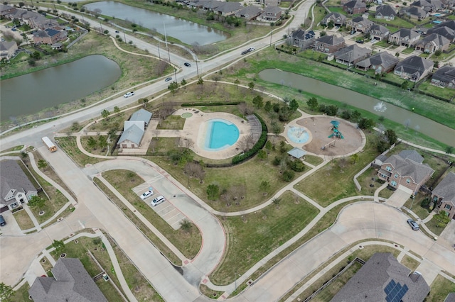 aerial view with a water view and a residential view