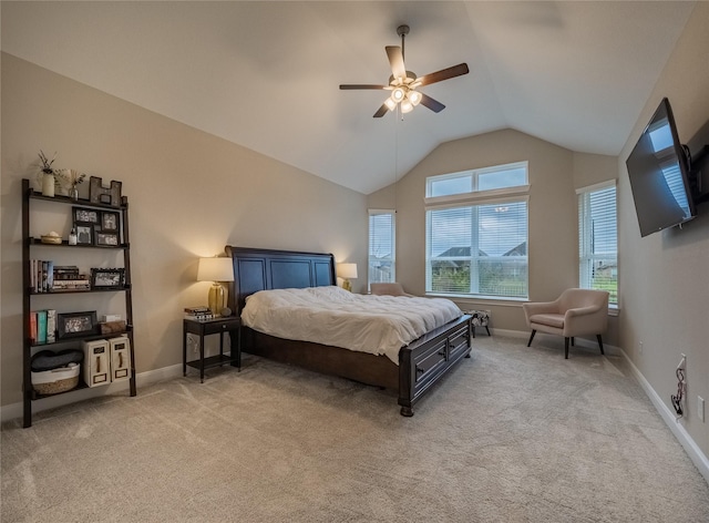 bedroom with light carpet, baseboards, a ceiling fan, and lofted ceiling