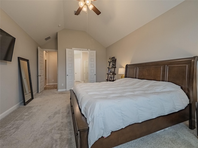 bedroom featuring vaulted ceiling, light carpet, visible vents, and baseboards