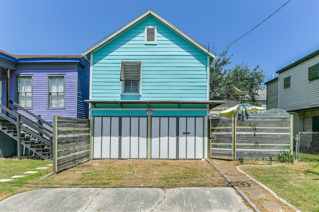 view of home's exterior with fence