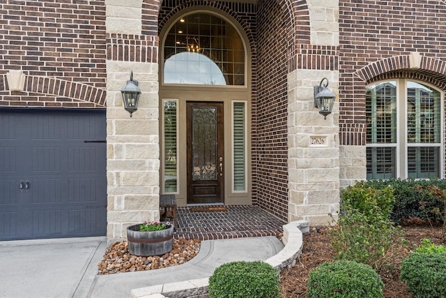 property entrance featuring stone siding and brick siding