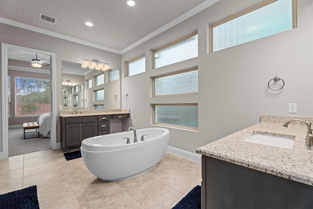 ensuite bathroom featuring crown molding, two vanities, visible vents, and a sink