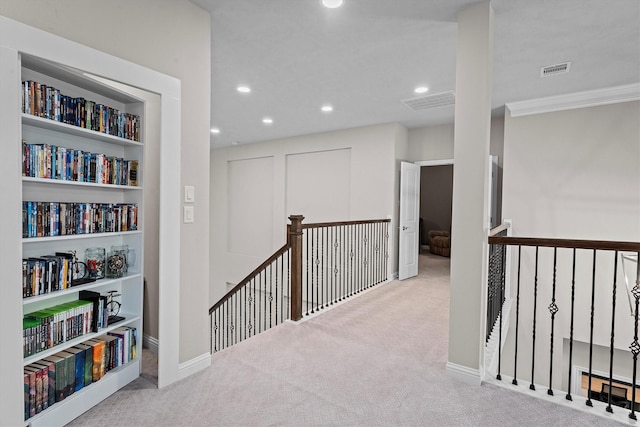 hall with carpet floors, built in shelves, recessed lighting, an upstairs landing, and baseboards