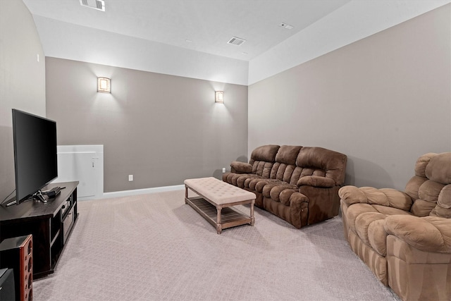 living room featuring light carpet, visible vents, and baseboards