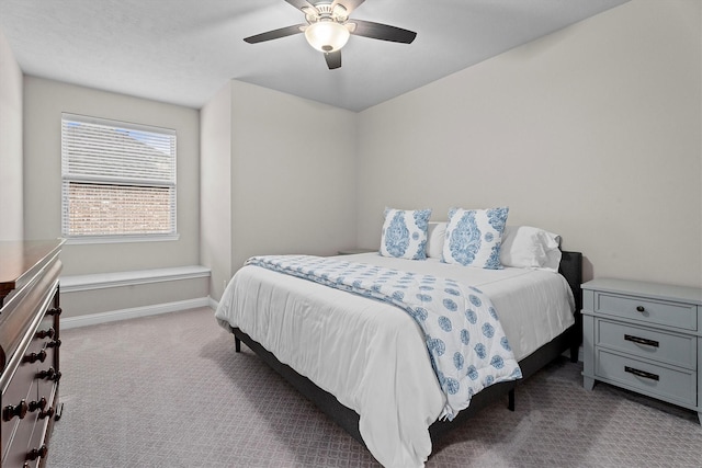 bedroom featuring ceiling fan, carpet floors, and baseboards