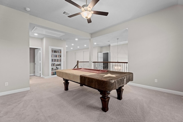 rec room featuring visible vents, light carpet, attic access, and baseboards