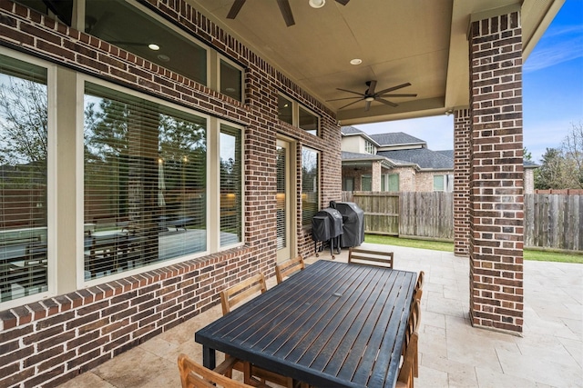 view of patio / terrace with ceiling fan, outdoor dining area, fence, and a grill