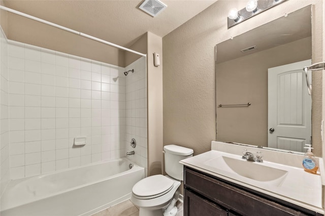 bathroom with shower / washtub combination, visible vents, vanity, and toilet