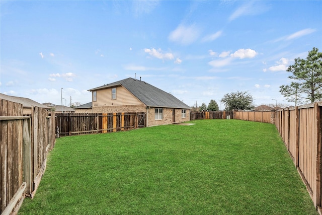 view of yard featuring a fenced backyard