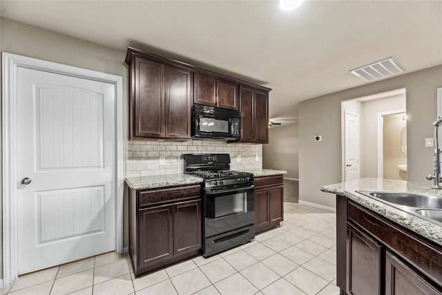 kitchen with light tile patterned floors, visible vents, backsplash, dark brown cabinets, and black appliances