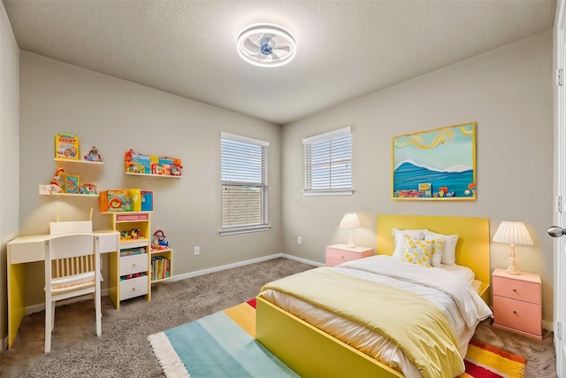 bedroom featuring carpet floors and baseboards