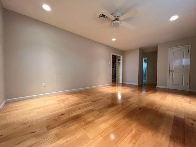 empty room with light wood-style flooring, baseboards, a ceiling fan, and recessed lighting