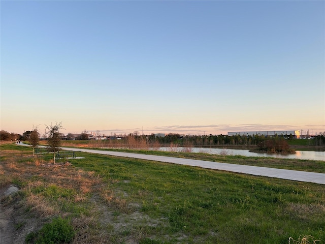 yard at dusk with a water view