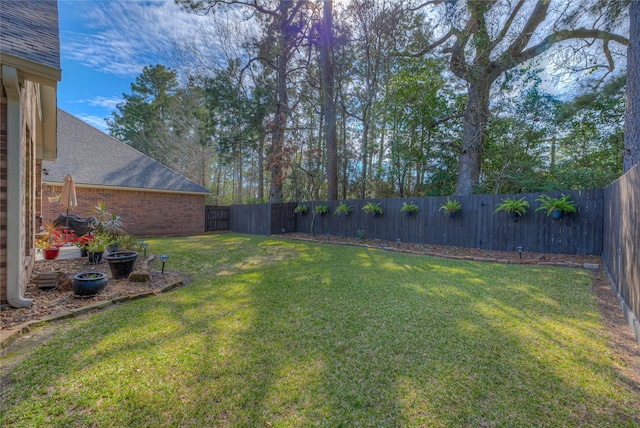 view of yard featuring a fenced backyard