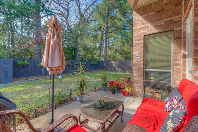 view of patio featuring a fenced backyard and outdoor lounge area