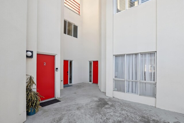 entrance to property featuring stucco siding