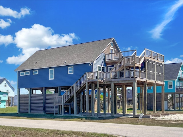 view of building exterior with stairway and a carport