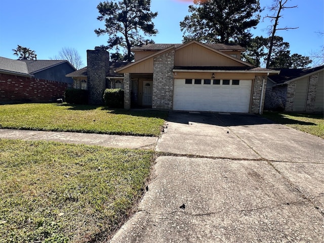 view of front facade with an attached garage, concrete driveway, brick siding, and a front yard