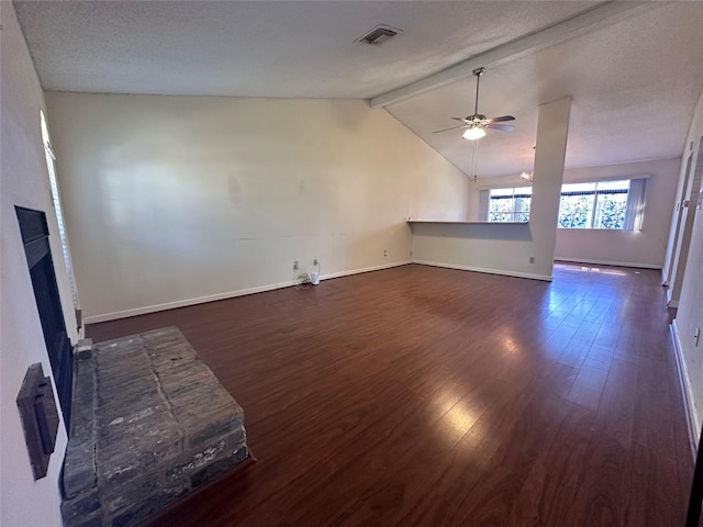 unfurnished living room featuring visible vents, lofted ceiling with beams, ceiling fan, dark wood-type flooring, and a fireplace