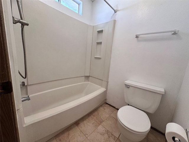 bathroom featuring toilet, shower / bath combination, and baseboards