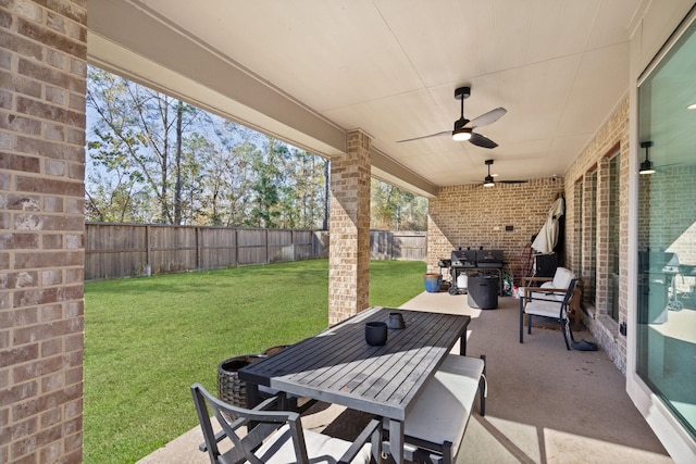 view of patio / terrace with a fenced backyard, ceiling fan, and outdoor dining space