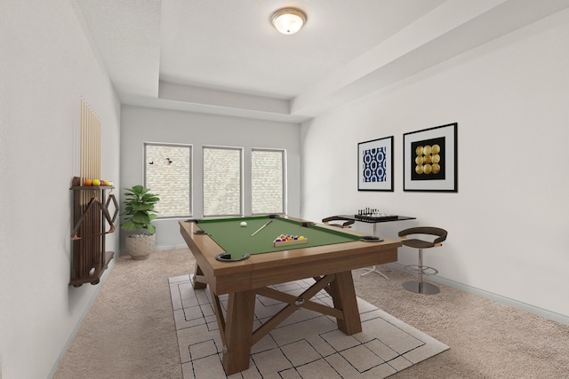 game room featuring baseboards, pool table, a tray ceiling, and light colored carpet