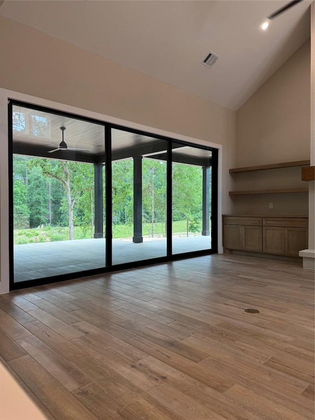 212 Rim Rock Rd, Huntsville, TX 77340 - unfurnished living room featuring lofted ceiling, light wood-style flooring, and ceiling fan