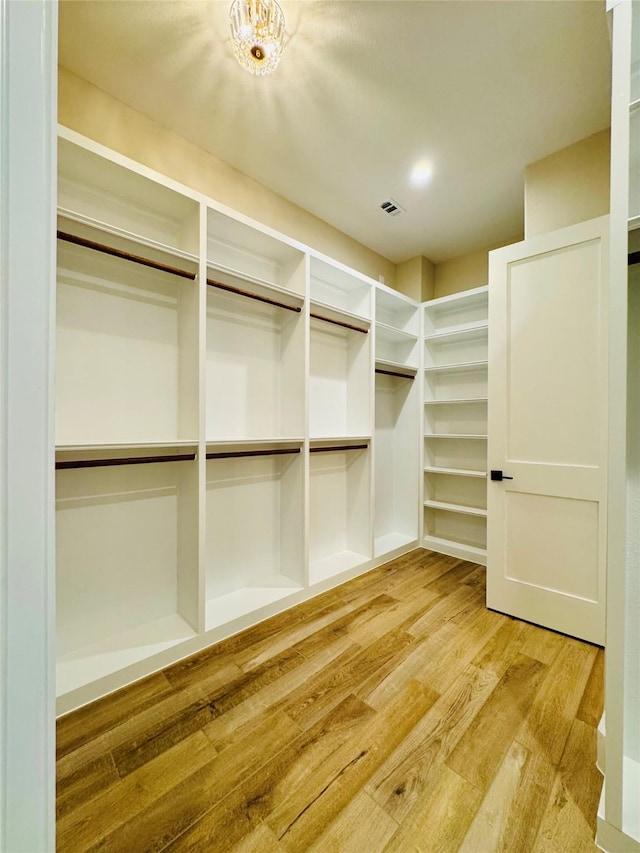 212 Rim Rock Rd, Huntsville, TX 77340 - spacious closet with light wood-style floors