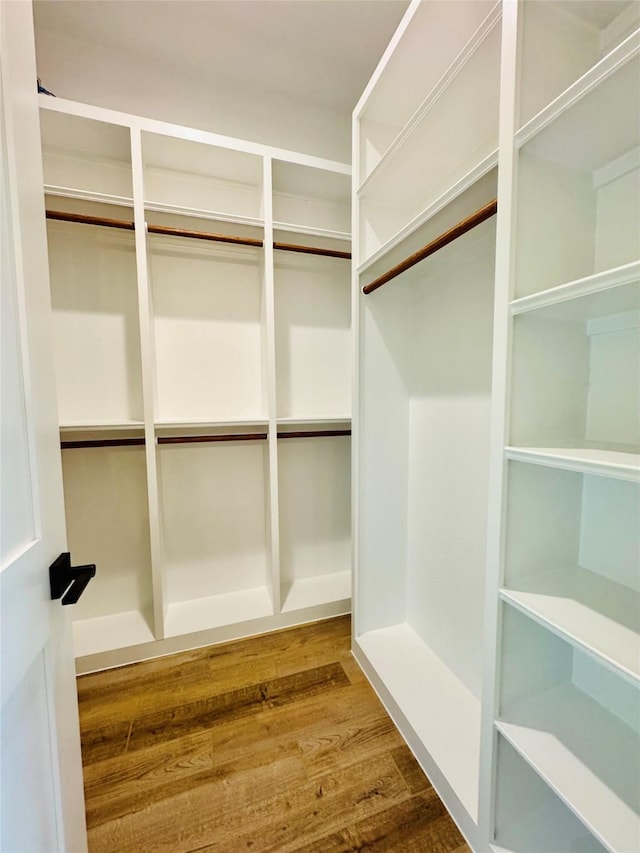 212 Rim Rock Rd, Huntsville, TX 77340 - walk in closet featuring wood finished floors