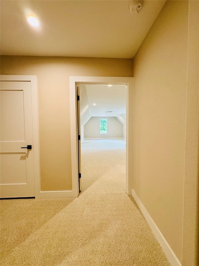 212 Rim Rock Rd, Huntsville, TX 77340 - hallway with carpet floors, baseboards, recessed lighting, and lofted ceiling