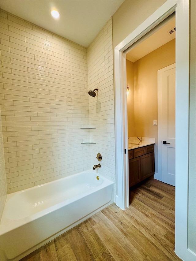212 Rim Rock Rd, Huntsville, TX 77340 - bathroom with wood finished floors, vanity, shower / bathtub combination, and recessed lighting