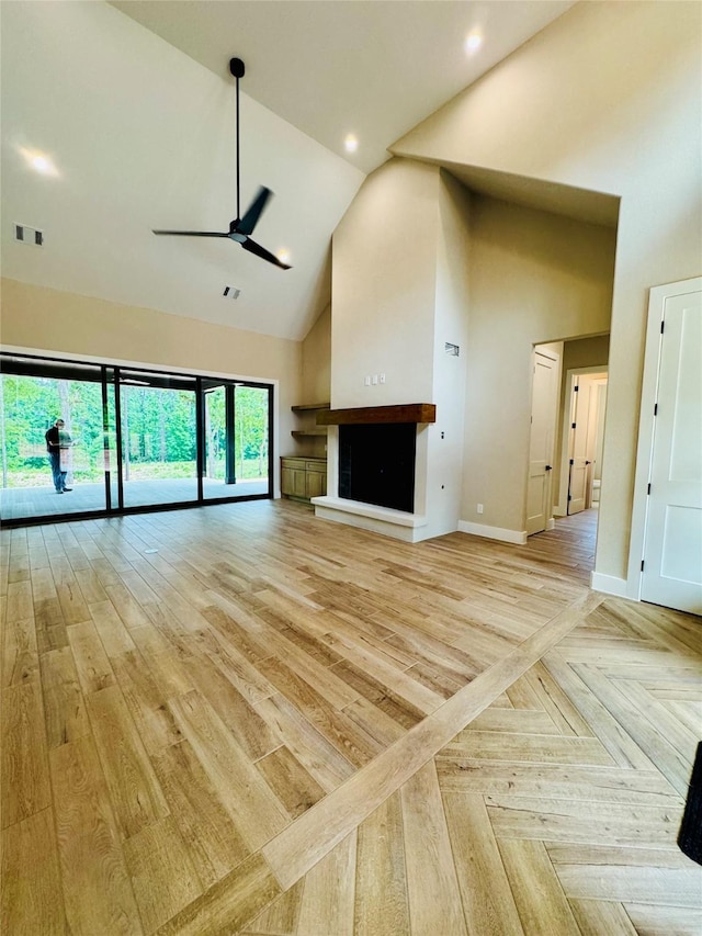 212 Rim Rock Rd, Huntsville, TX 77340 - unfurnished living room featuring high vaulted ceiling, a ceiling fan, baseboards, and recessed lighting