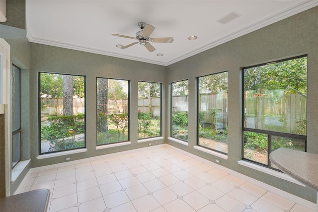 unfurnished sunroom with visible vents and a ceiling fan