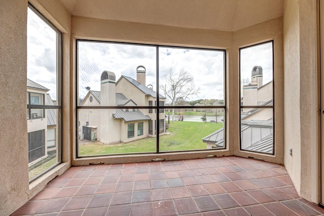 unfurnished sunroom featuring a wealth of natural light