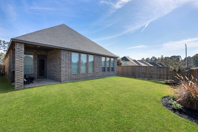 view of yard featuring a patio and a fenced backyard