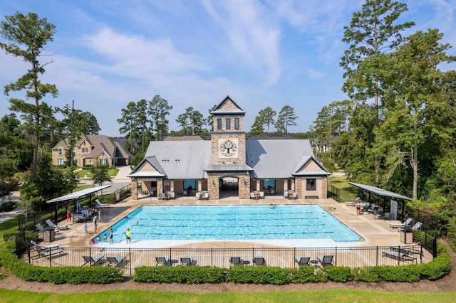 pool featuring a patio and fence