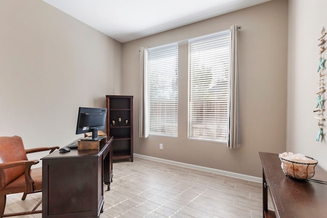 office with a wealth of natural light and baseboards