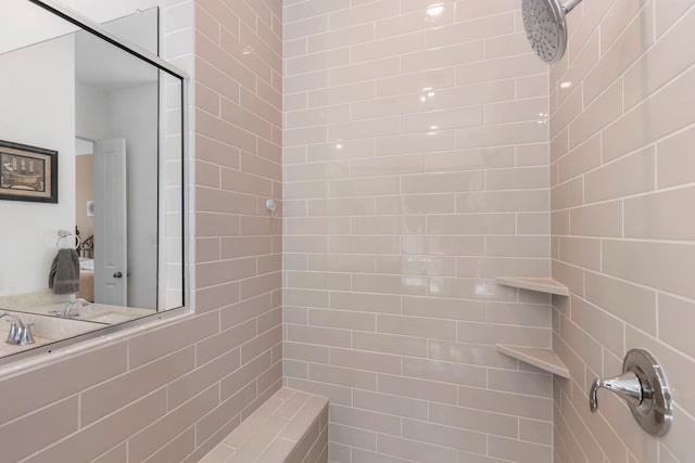 bathroom with a tile shower