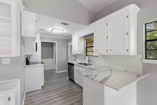 kitchen featuring dishwasher, a sink, visible vents, and white cabinetry