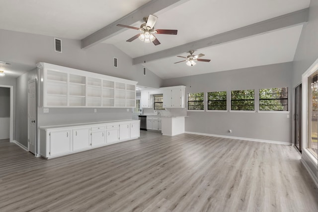 unfurnished living room featuring vaulted ceiling with beams, light wood-type flooring, a ceiling fan, and baseboards