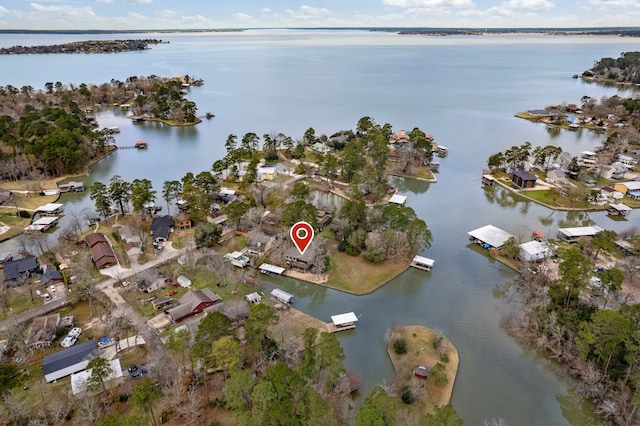 birds eye view of property featuring a water view and a residential view