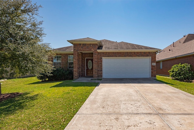 view of front of property with driveway, brick siding, a shingled roof, an attached garage, and a front yard