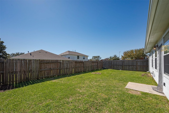 view of yard featuring a fenced backyard