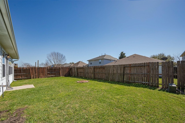 view of yard with a fenced backyard