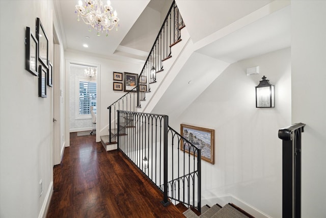 hallway with stairway, baseboards, and wood finished floors