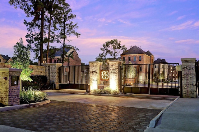 view of gate at dusk